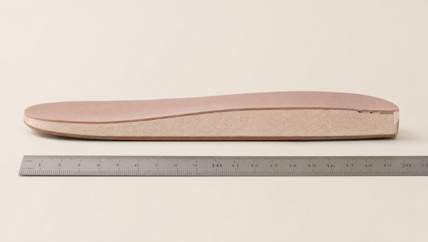 Cross-section of the Derby Soft footbed showing 10 mm of padding under the forefoot, against a millimetre rule.