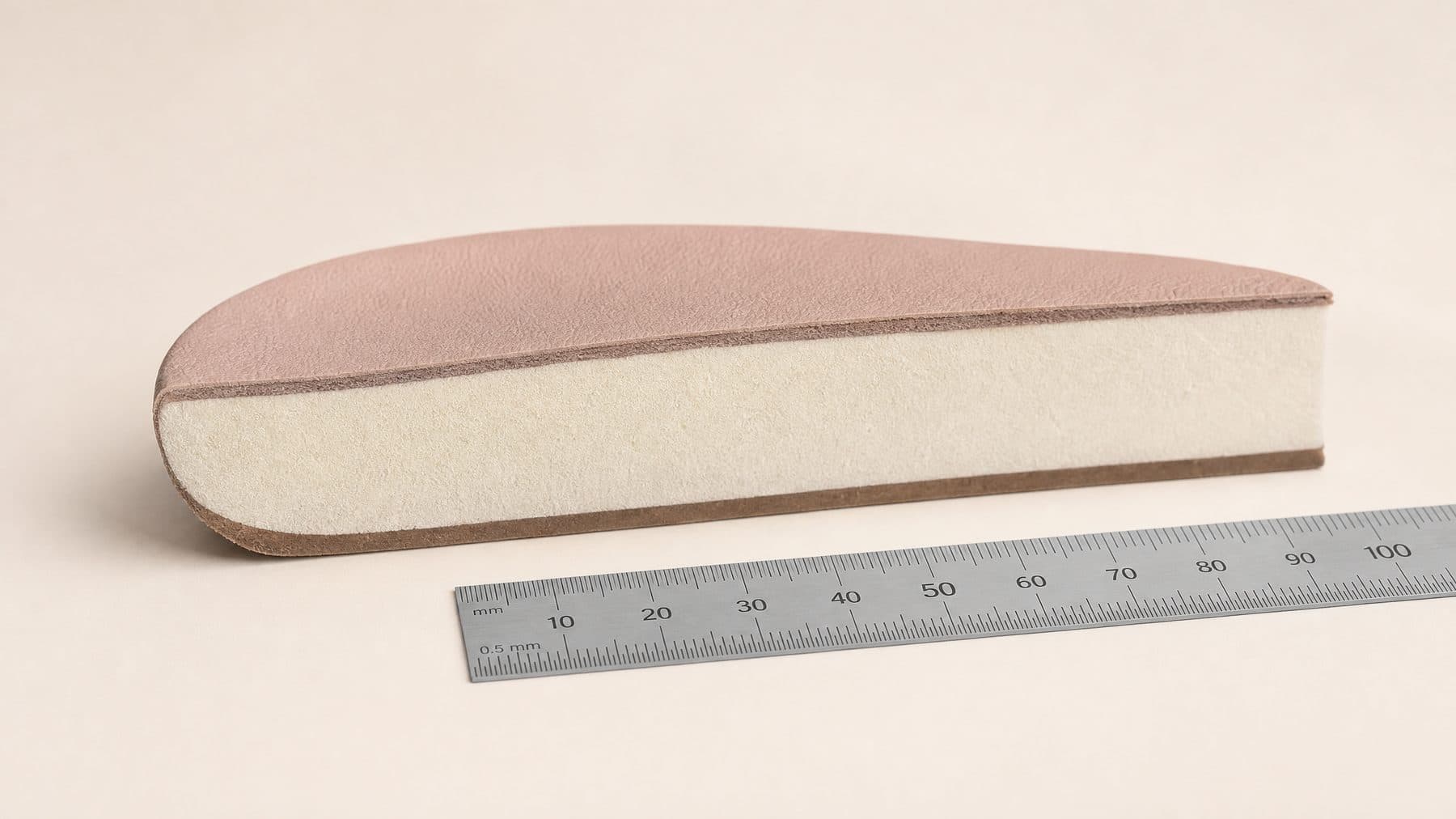 Cross-section of the Loafer Wide Fit footbed showing 12 mm of padding under the forefoot, against a millimetre rule.